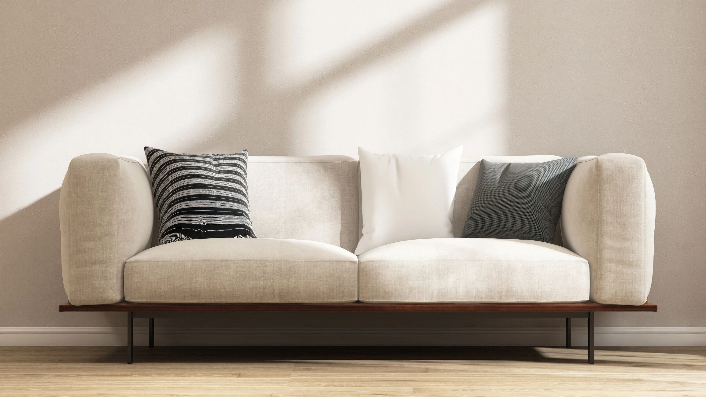 Warm minimal living room with beige sofa and soft natural light